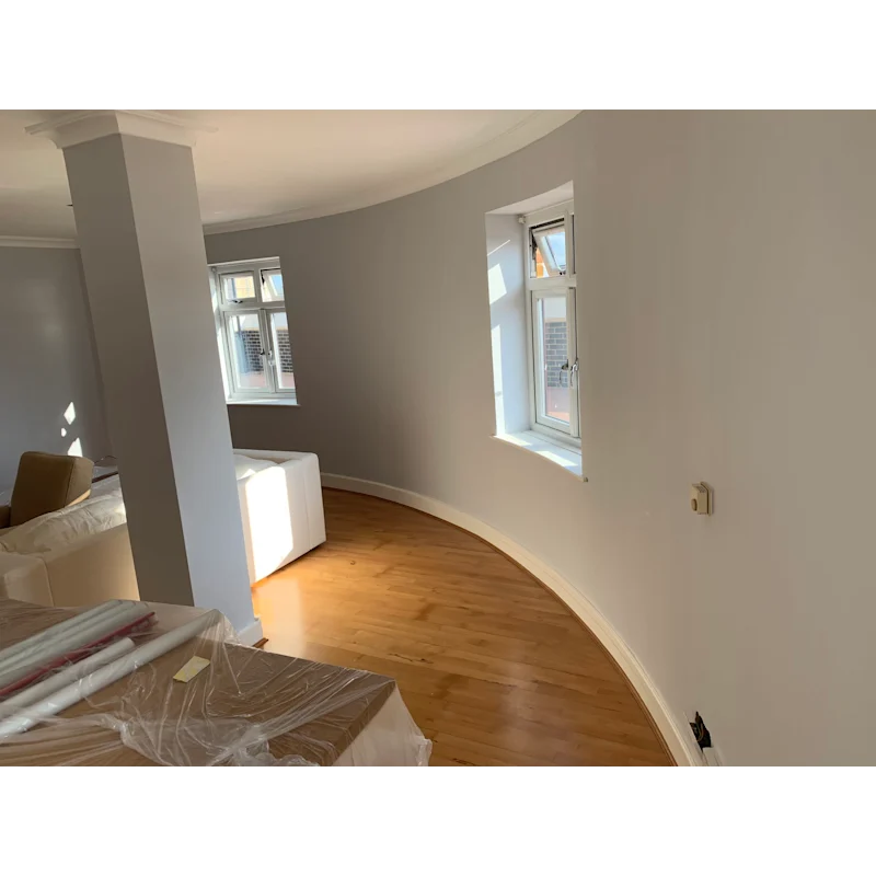 Curved-wall apartment with oak floors