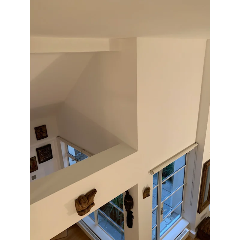 Double-height atrium with gallery walls